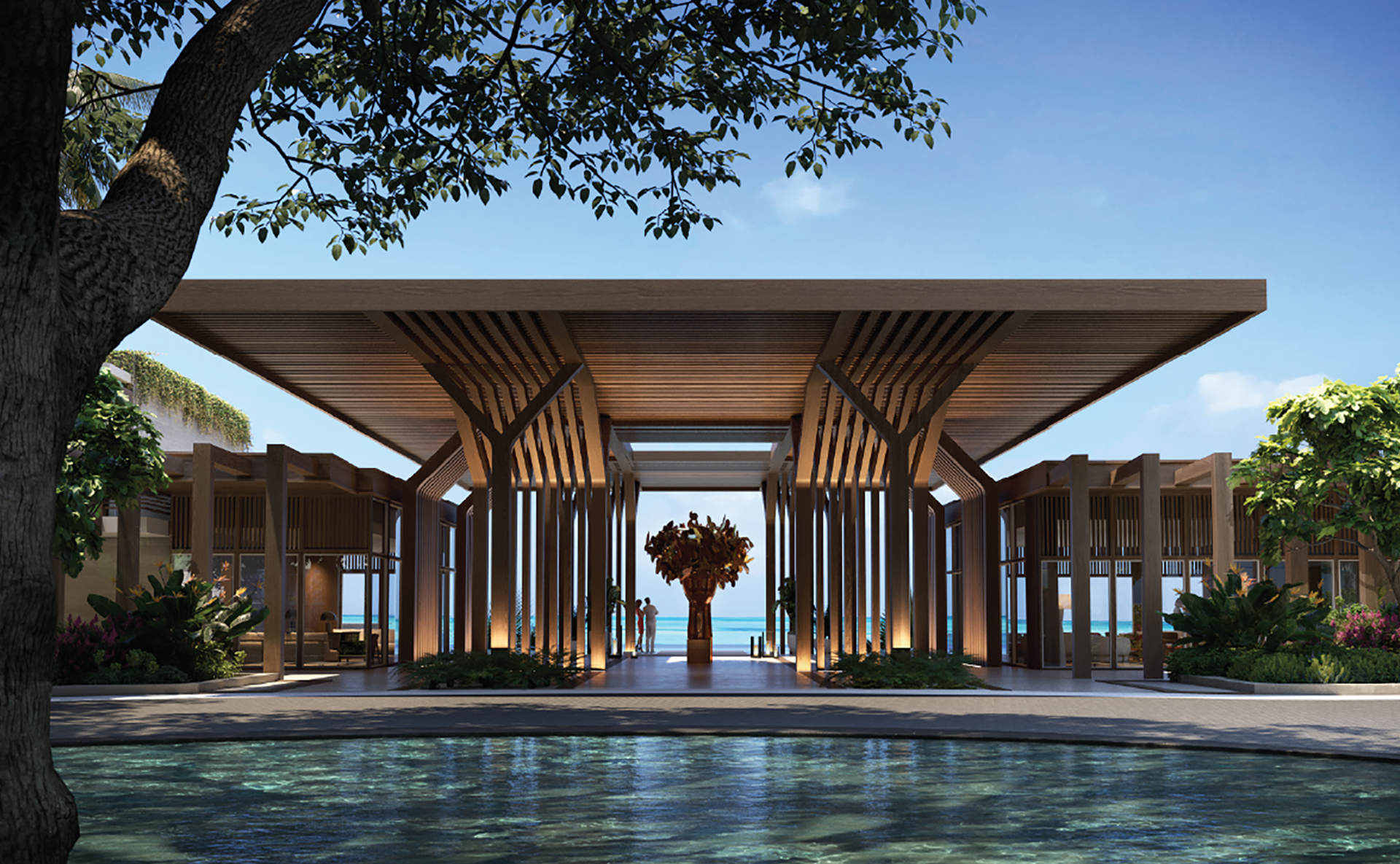 The grand entrance of the Setai St. Maarten lobby featuring striking modern timber architecture with vertical columns, a central art installation, and a view through the open-air structure to the turquoise ocean.