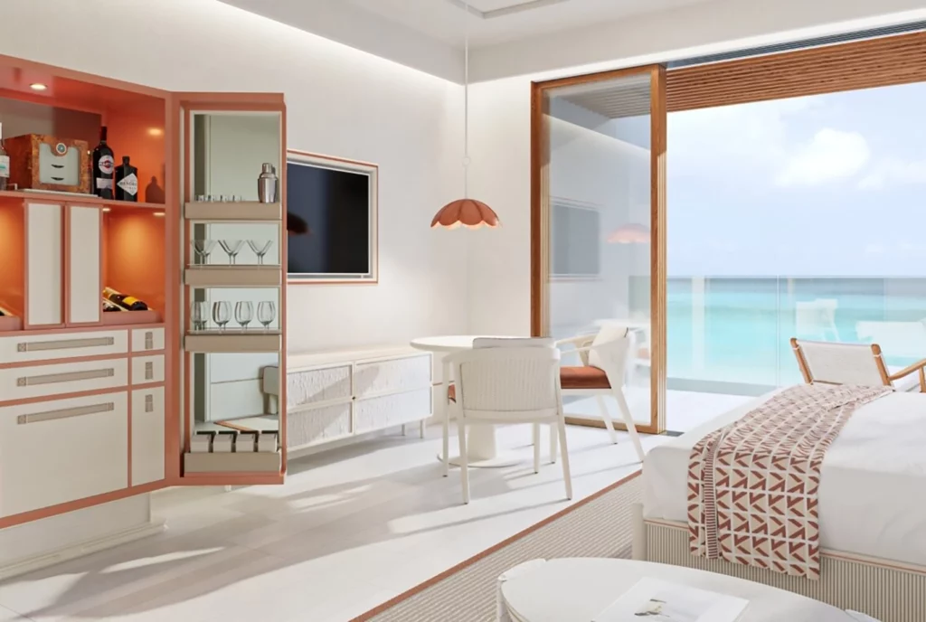 The Setai St. Marteen Pinel residence room with bedroom and balcony overlooking water